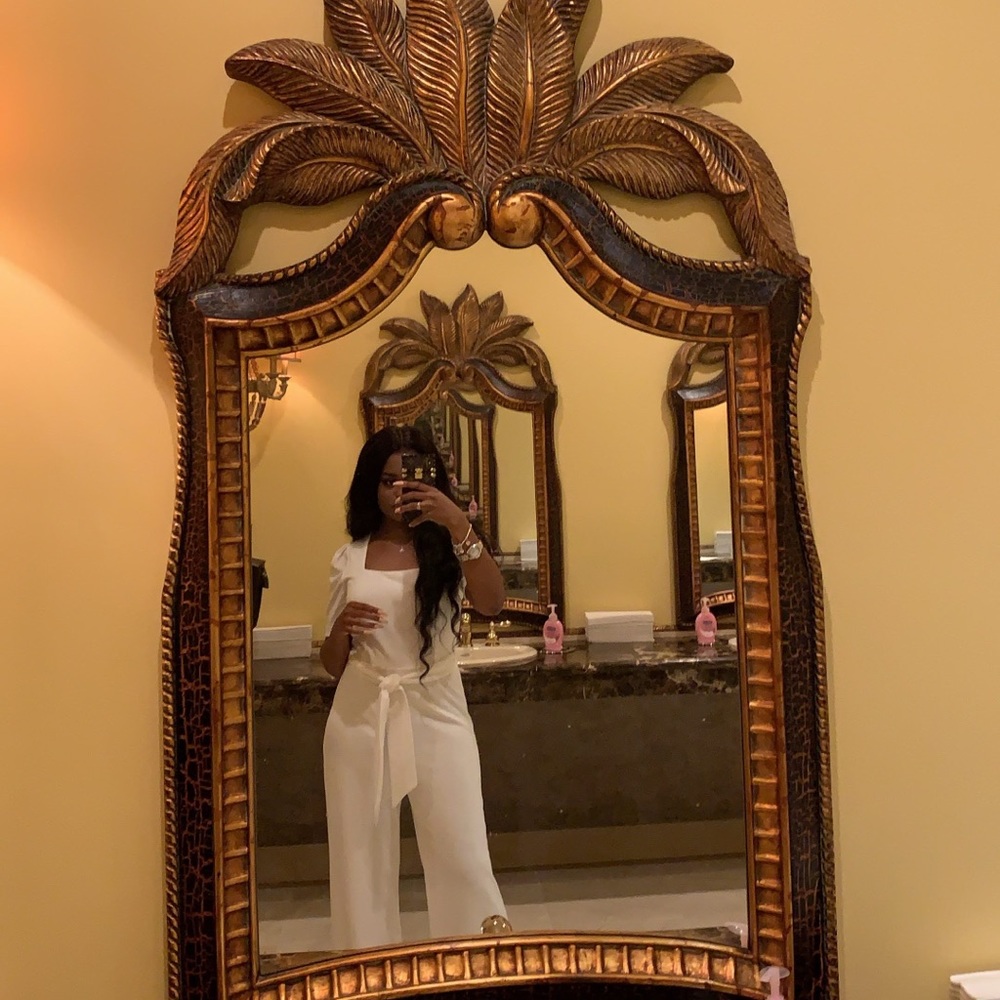 white jumpsuit w/ matching belt.